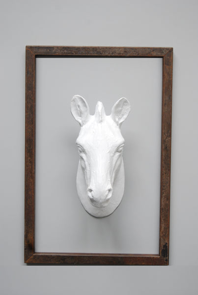 Metal frame with white resin zebra